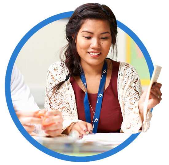 lady looking through paperwork on desk